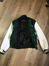 Load image into Gallery viewer, Kingspier Vintage - Roots “Sobey’s Centenary Anniversary” ’07 varsity jacket in green and white with snap closures, slash pockets, knit trim, embroidered “100” emblem on the chest and “07” on the arm.
