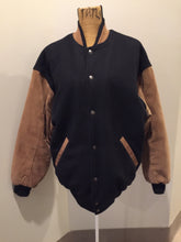 Load image into Gallery viewer, Kingspier Vintage - Trimark black and brown wool/leather varsity jacket with knit trim, snap closures, slash pockets quilted lining and inside pocket. Size large.
