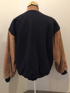 Kingspier Vintage - Trimark black and brown wool/leather varsity jacket with knit trim, snap closures, slash pockets quilted lining and inside pocket. Size large.