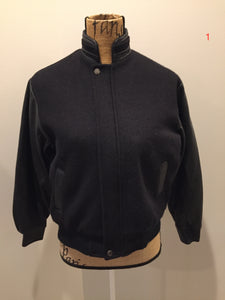 Kingspier Vintage - Concord black leather and wool varsity jacket with zipper and snap closures and slash pockets. Size XS.