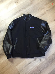 Kingspier Vintage - Canada Post uniform leather and wool blend varsity jacket in black with zipper and snap closures and slash pockets. Size large.