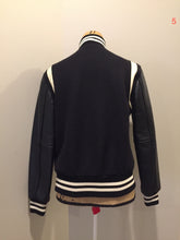 Load image into Gallery viewer, Kingspier Vintage - Roots wool and leather black varsity jacket with white stripe details, knit trim, snap closures, slash pockets and inside pocket. Made in Canada. Ladies size S.
