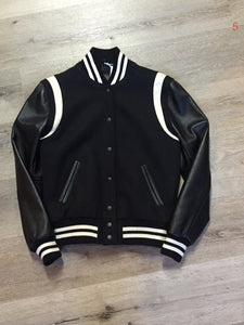 Kingspier Vintage - Roots wool and leather black varsity jacket with white stripe details, knit trim, snap closures, slash pockets and inside pocket. Made in Canada. Ladies size S.