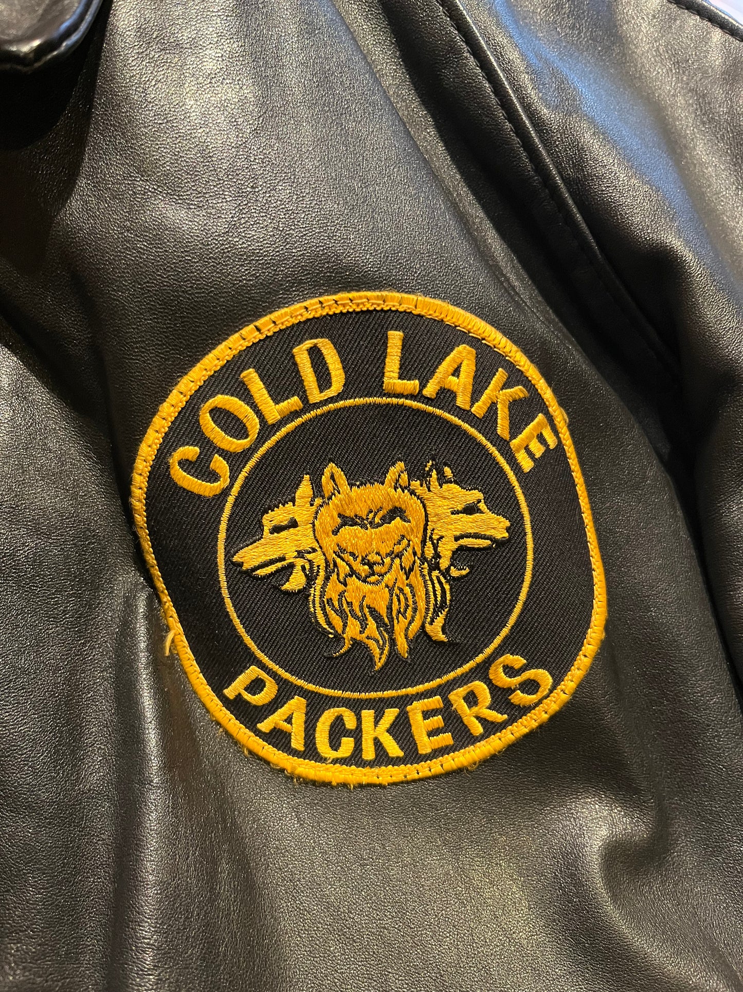 Vintage Cold Lake Packers Leather Varsity Jacket by Athletes Wear Co. LTD.

Jacket features embroidered detail on the chest, two front pockets and snap closures.

Made in Canada.
Chest 46”.