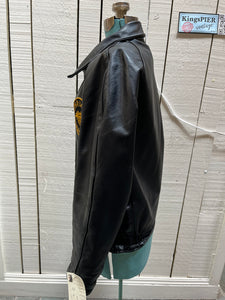 Vintage Cold Lake Packers Leather Varsity Jacket by Athletes Wear Co. LTD.

Jacket features embroidered detail on the chest, two front pockets and snap closures.

Made in Canada.
Chest 46”.