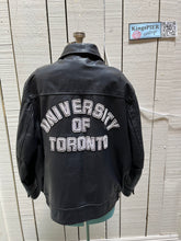 Load image into Gallery viewer, Vintage University of Toronto 1998 English Department Leather Varsity Jacket.

Jacket features embroidered details on the chest, arms and back, two front pockets, zipper and snap closures and a zip out quilted lining.

Size 46.
