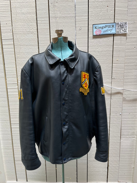 Vintage 70’s Waterloo Engineering Letterman’s leather varsity jacket by Export Leather Garments LTD.
Jacket features embroidered details on the chest, arms and back, two front pockets, zipper and snap closures and a quilted lining.
Made in Canada.
Size 52.