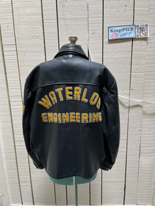 Vintage 70’s Waterloo Engineering Letterman’s leather varsity jacket by Export Leather Garments LTD.

Jacket features embroidered details on the chest, arms and back, two front pockets, zipper and snap closures and a quilted lining.

Made in Canada.
Size 52.
