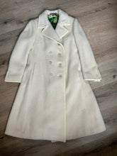 Load image into Gallery viewer, Kingspier Vintage - Miss Lodenfrey white Australian wool coat with lovely braided trim detailing, double breasted with button closures and front pockets. This coat features a bright green paisley lining. Made in Austria. Size small.
