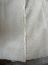 Load image into Gallery viewer, Kingspier Vintage - Miss Lodenfrey white Australian wool coat with lovely braided trim detailing, double breasted with button closures and front pockets. This coat features a bright green paisley lining. Made in Austria. Size small.
