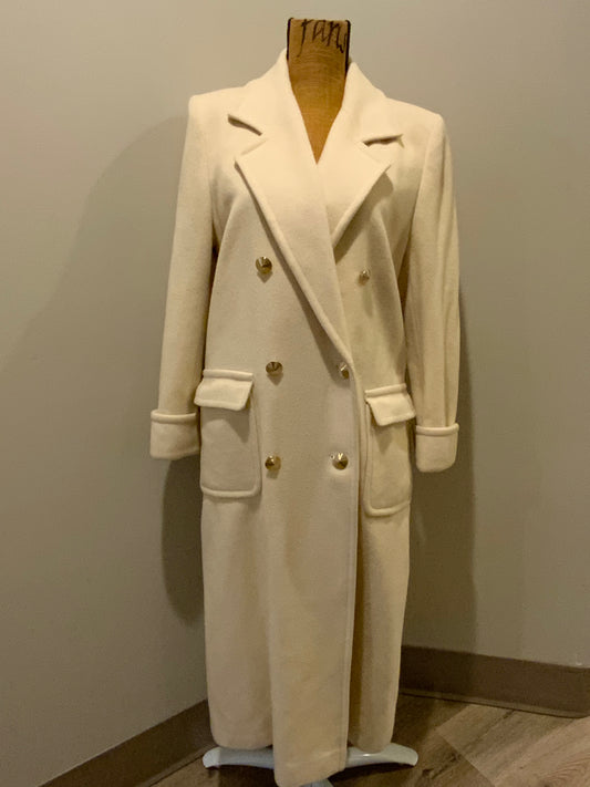 Kingspier Vintage - Raffinati 1980’s double breasted wool blend coat in cream. This coat features unique gold buttons in front, front pockets and a belt in the back. Fits a size 8.