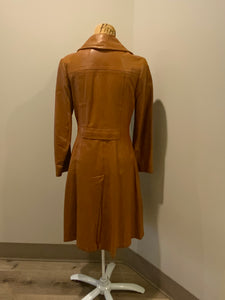 Kingspier Vintage - Form fitting 1970’s full length caramel brown leather coat with buttons down the front and a fun woven motif lining.