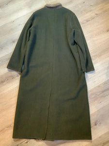 Kingspier Vintage - Epsilon full length moss green 100% wool coat with sheepskin panel running down the front. button closures with unique flower detail, front pockets and a zip out inside lining. Made in Canada. Fits a size large.