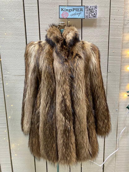 Kingspier Vintage - Vintage Greenwich Furs light brown fur coat with hook and eye closures and two front pockets.

Made in USA