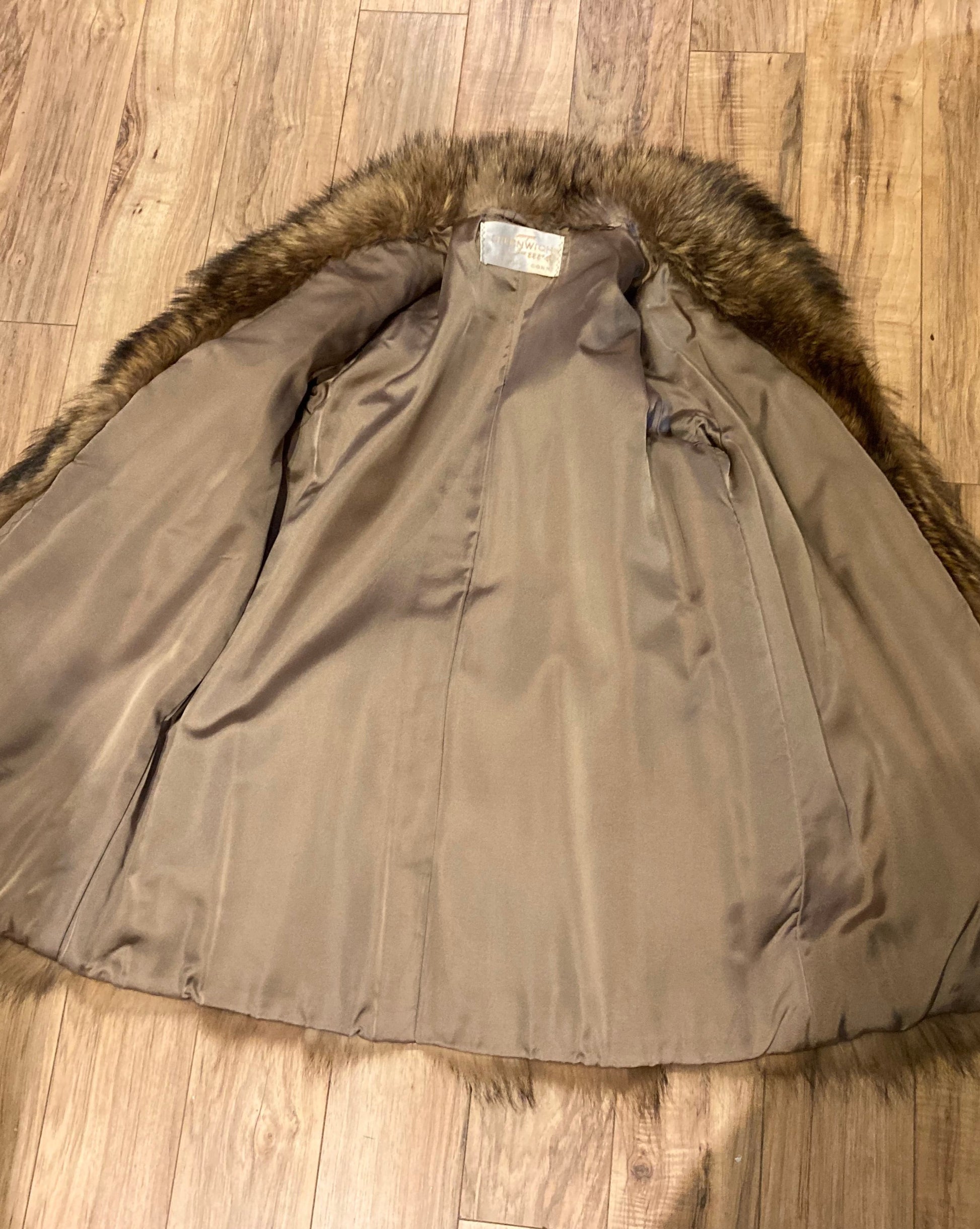 Kingspier Vintage - Vintage Greenwich Furs light brown fur coat with hook and eye closures and two front pockets.

Made in USA