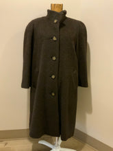 Load image into Gallery viewer, Kingspier Vintage - Regency 1970’s dark brown alpaca wool full length coat with front pockets and buttons, shoulder pads and pleating detail in the back. Features an ILGWU, Made in the USA label on inner lining. Fits a Size 8.
