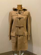 Load image into Gallery viewer, Kingspier Vintage - Sears textured beige wool blend duffle coat with hood, zipper, wooden toggles, flap pockets and tartan lining. Made in Canada. Size 36. 
