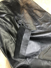 Load image into Gallery viewer, Danier black leather straight leg pants with side zip closure, partially lined. Size 4 Canadian (28x31).

