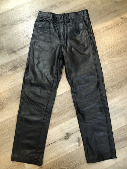 Vintage black full grain leather straight leg pants with zip and snap closure, pockets in the front and back. Size 30x29.
