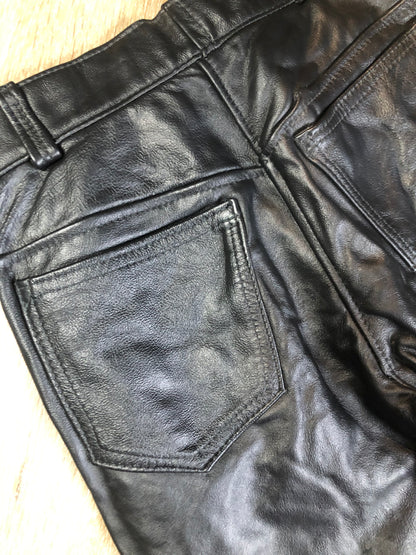 Vintage black full grain leather straight leg pants with zip and snap closure, pockets in the front and back. Size 30x29.
