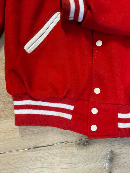 Kingspier Vintage - Melrose Youth Hockey letterman’s jacket in red with white accents, embroidered emblem on the front and lettering on the back with monogram on shoulder “Kevin”. Snap closures, slash pockets. Made in the USA. Size M.