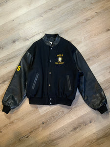 Kingspier Vintage - Dartmouth High School AAA Hockey letterman’s jacket in black with snap closures, slash pockets, quilted lining and embroidered team emblem. Made in Canada. Size XL.
