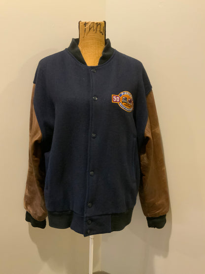 Kingspier Vintage - Ford F-Series 50 year anniversary letterman’s jacket in navy with brown leather sleeves, snap closures, slash pockets and an inside pocket.
