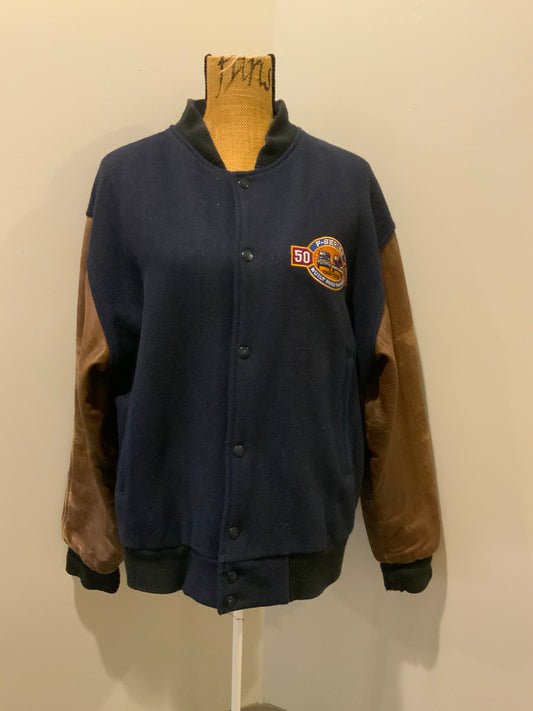 Kingspier Vintage - Ford F-Series 50 year anniversary letterman’s jacket in navy with brown leather sleeves, snap closures, slash pockets and an inside pocket.