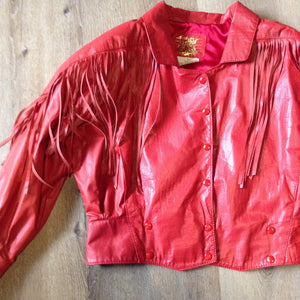 Kingspier Vintage - The Leather Ranch red fringe leather jacket with snap closures and red satin lining . Made in Canada, size XL.
