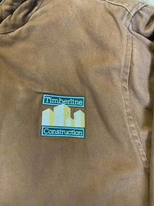 Kingspier Vintage - Charles River tan canvas work jacket with slash pockets, patch pockets, hood, “ timberline construction” embroidered emblem and quilted lining with inside pockets.