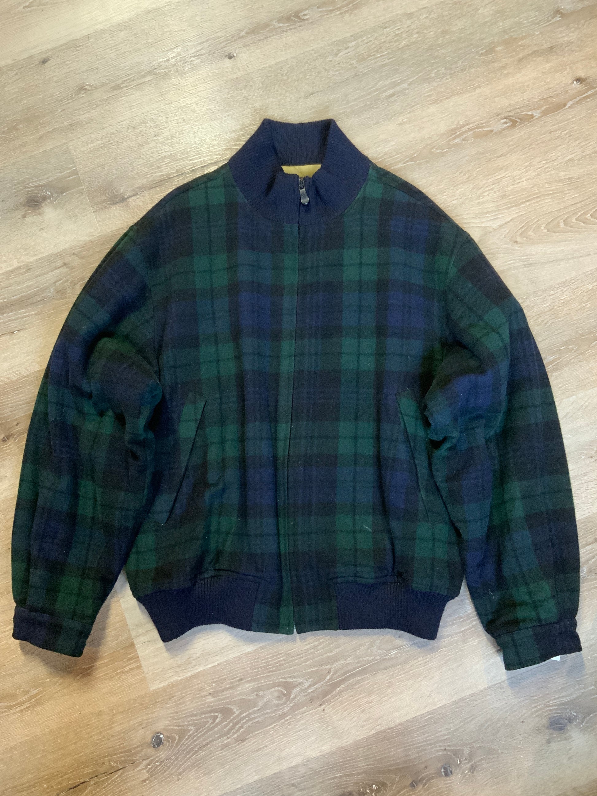 Kingspier Vintage - Nautica green and black “black watch” tartan wool jacket with knit trim collar, zipper, slash pockets and quilted lining. Size XL. 