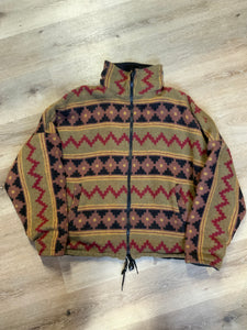 Kingspier Vintage - Reversible jacket with one side black denim and one side colourful green, red, purple ,yellow and black design, front zipper, slash pockets and a drawstring at the waist. 