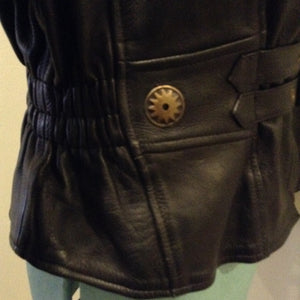 Kingspier Vintage -Vintage black leather moto jacket with brass hardware and zipper closure, belt details and a zipper reveals a vent in the back . Size large.
