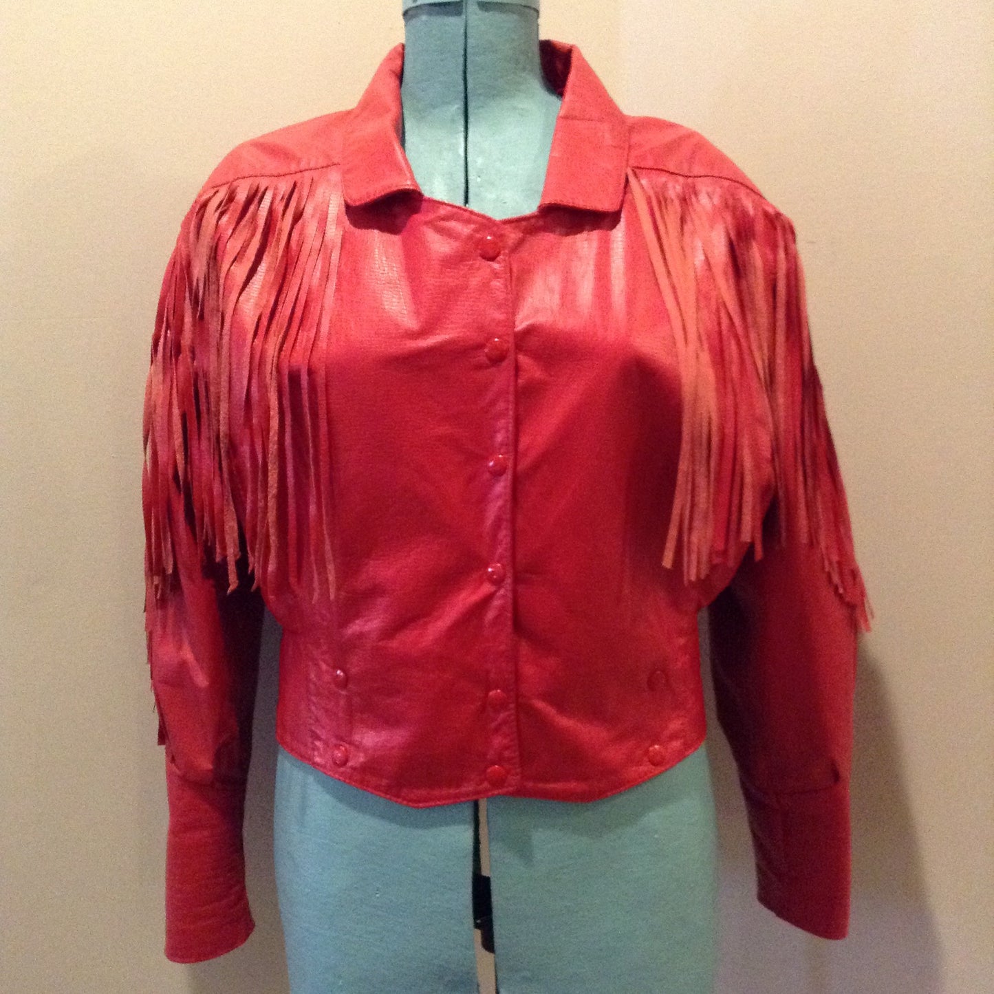 Kingspier Vintage - The Leather Ranch red fringe leather jacket with snap closures and red satin lining . Made in Canada, size XL.
