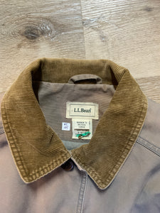 Kingspier Vintage - LL Bean distressed purple chore jacket with beige corduroy collar and cuffs, two slash pockets for keeping your hands warm, two flap pockets and button closures. Size petite Large.