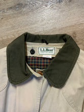 Load image into Gallery viewer, Kingspier Vintage - L.L.Bean beige field jacket with green corduroy collar and cuff, four front patch pockets and one zip pocket, button closures, removable plaid &quot;Prima Loft&quot; synthetic down lining. Size large petite women’s. 
