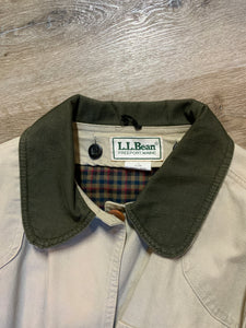 Kingspier Vintage - L.L.Bean beige field jacket with green corduroy collar and cuff, four front patch pockets and one zip pocket, button closures, removable plaid "Prima Loft" synthetic down lining. Size large petite women’s. 