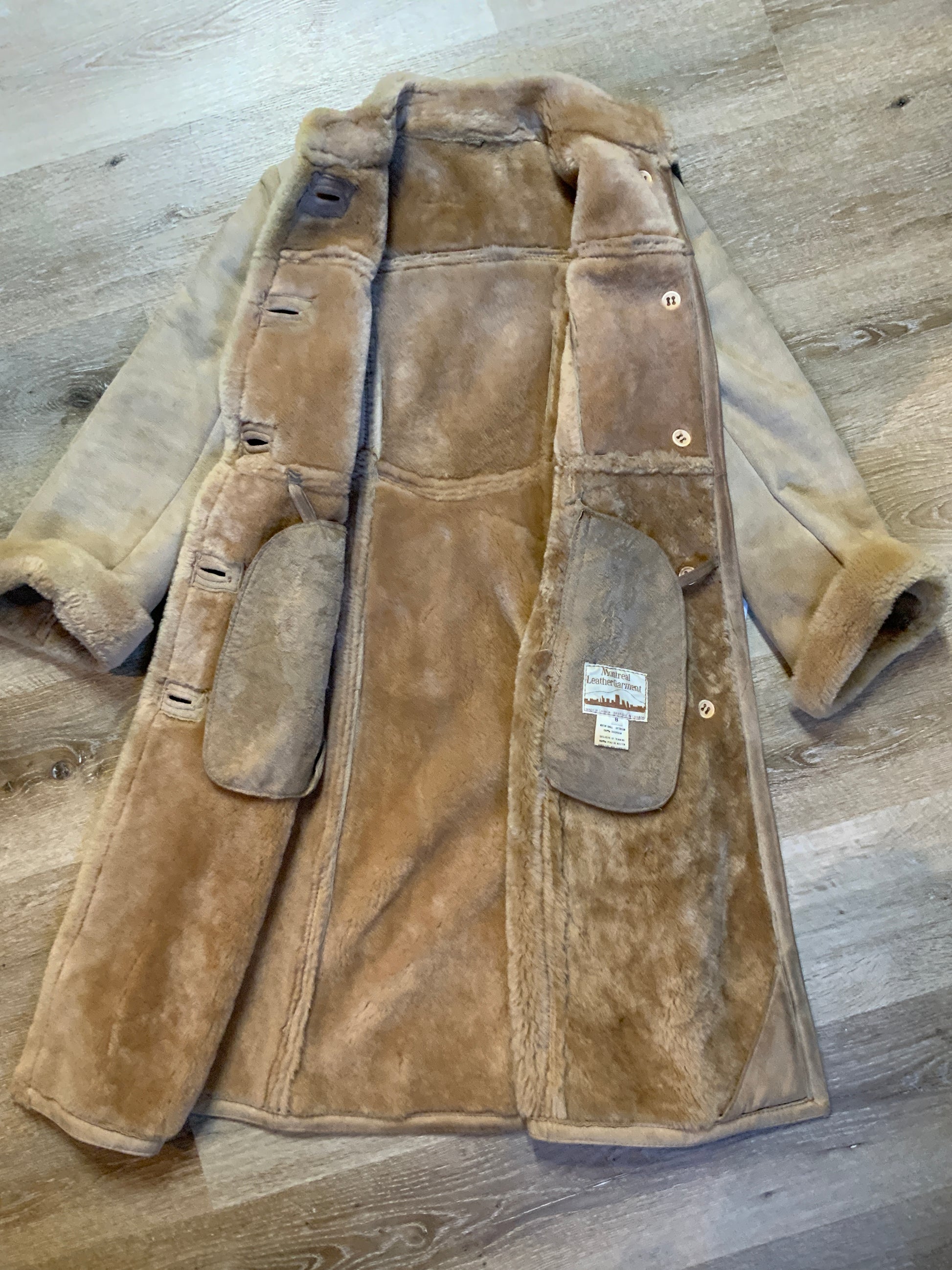 Kingspier Vintage - Montreal Leather Garment Sheepskin coat with shearling trim and lining, button closures and slash pockets.