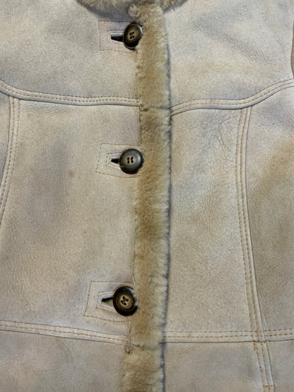 Kingspier Vintage - Montreal Leather Garment Sheepskin coat with shearling trim and lining, button closures and slash pockets.