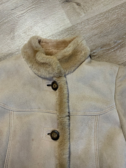 Kingspier Vintage - Montreal Leather Garment Sheepskin coat with shearling trim and lining, button closures and slash pockets.