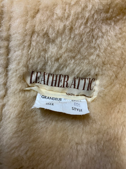 Kingspier Vintage - Leather Attic light brown sheepskin coat with shearling trim and lining, button closures and patch pockets.