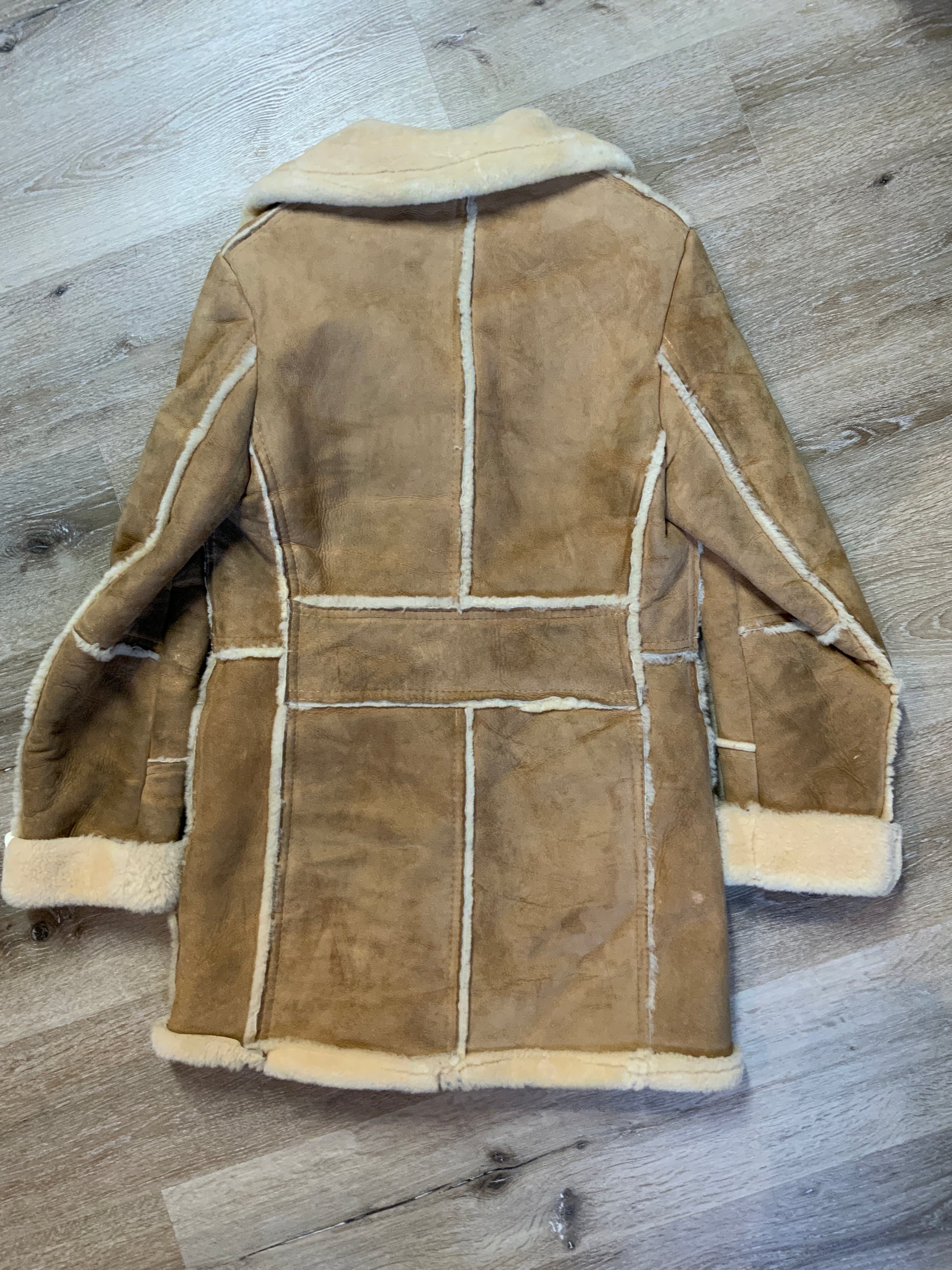 Kingspier Vintage - Leather Attic light brown sheepskin coat with shearling trim and lining, button closures and patch pockets.