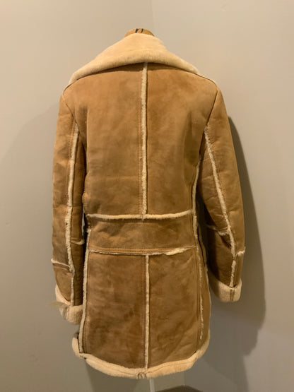 Kingspier Vintage - Leather Attic light brown sheepskin coat with shearling trim and lining, button closures and patch pockets.