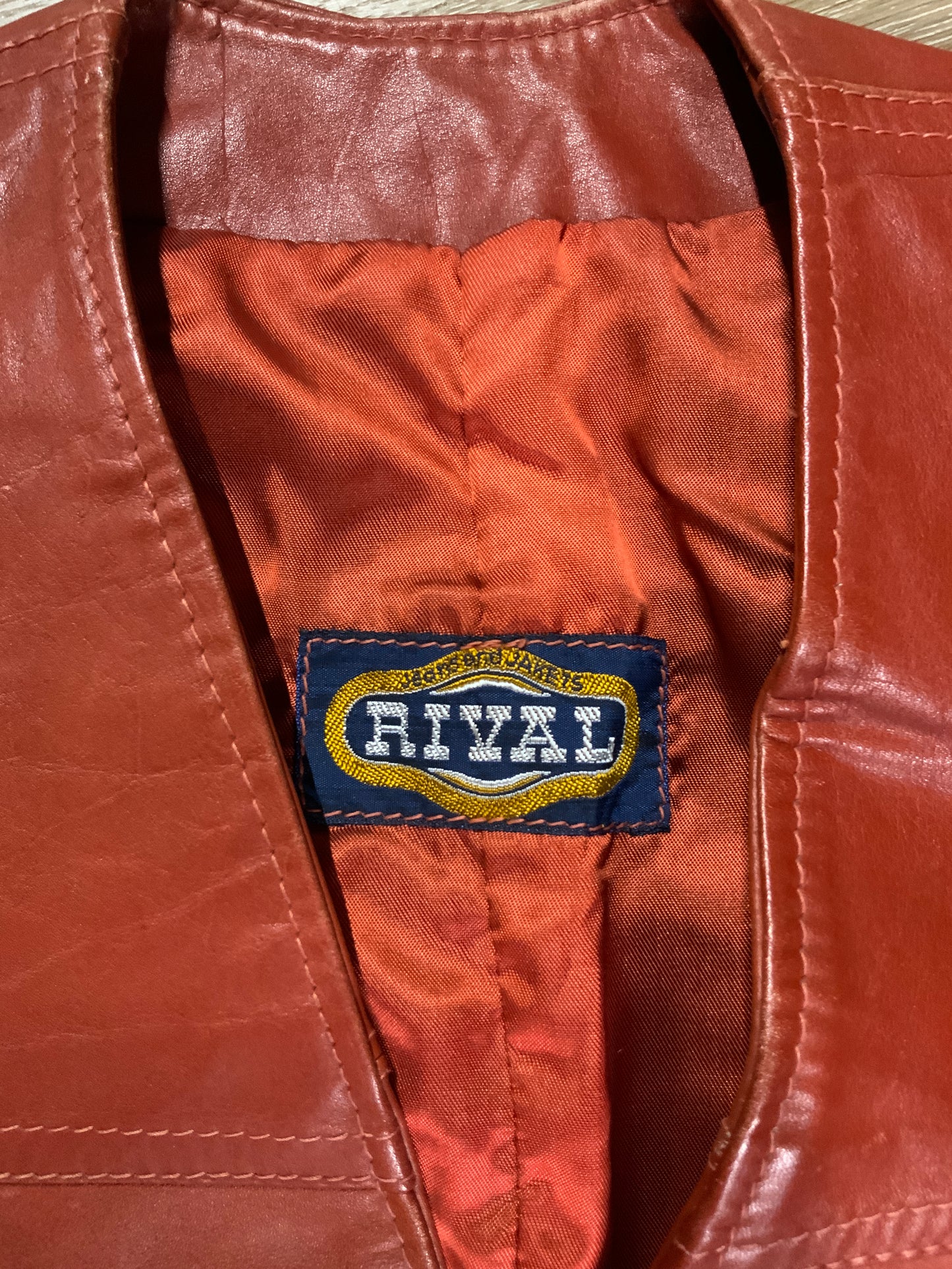 Kingspier Vintage - Rival rust leather vest with snap closures and patch pockets.