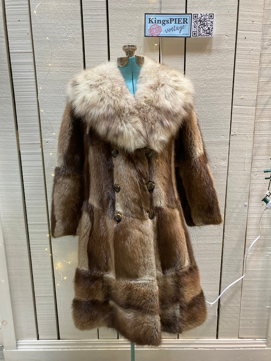 Kingspier Vintage - Vintage 70’s Mitchell Fur Co. Fur Coat features an exaggerated fur collar, double breasted button closures, D,A,P monogram and a bottom portion that zips off to give the option of a shorter jacket.

Made in Canada.