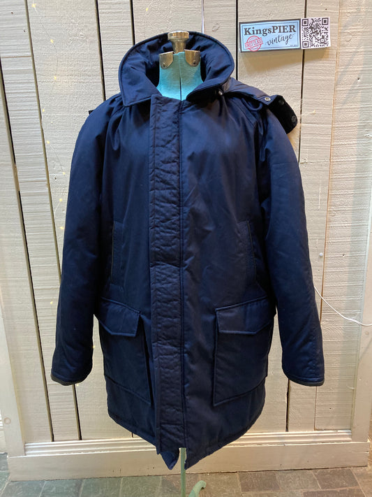 Kingspier Vintage - Vintage Northern Spirit navy blue down-filled parka with coyote fur trimmed removable hood, leather trim, zipper closure and front flap pockets.
