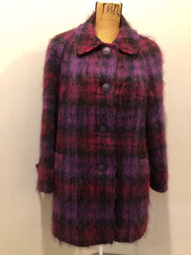 Kingspier Vintage - Fashion Gallery 1990’s Mohair/Wool blend purple and pink plaid jacket. This jacket features front welt pockets, four large iridescent purple buttons and black satin lining. Size 12.