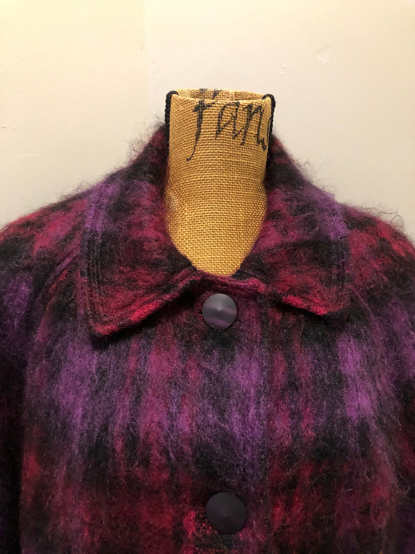 Kingspier Vintage - Fashion Gallery 1990’s Mohair/Wool blend purple and pink plaid jacket. This jacket features front welt pockets, four large iridescent purple buttons and black satin lining. Size 12.