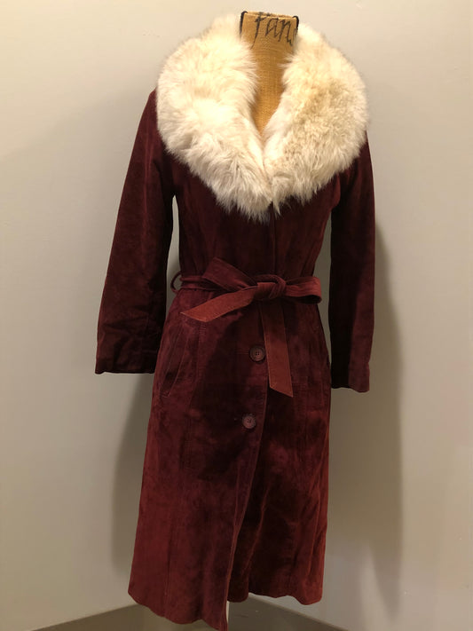 Kingspier Vintage - Leather Attic 1970’s oxblood suede coat with fur collar. Beautifully fitted, the coat features pockets, buttons, a belt and a quilted lining. Made in Canada. Size small.