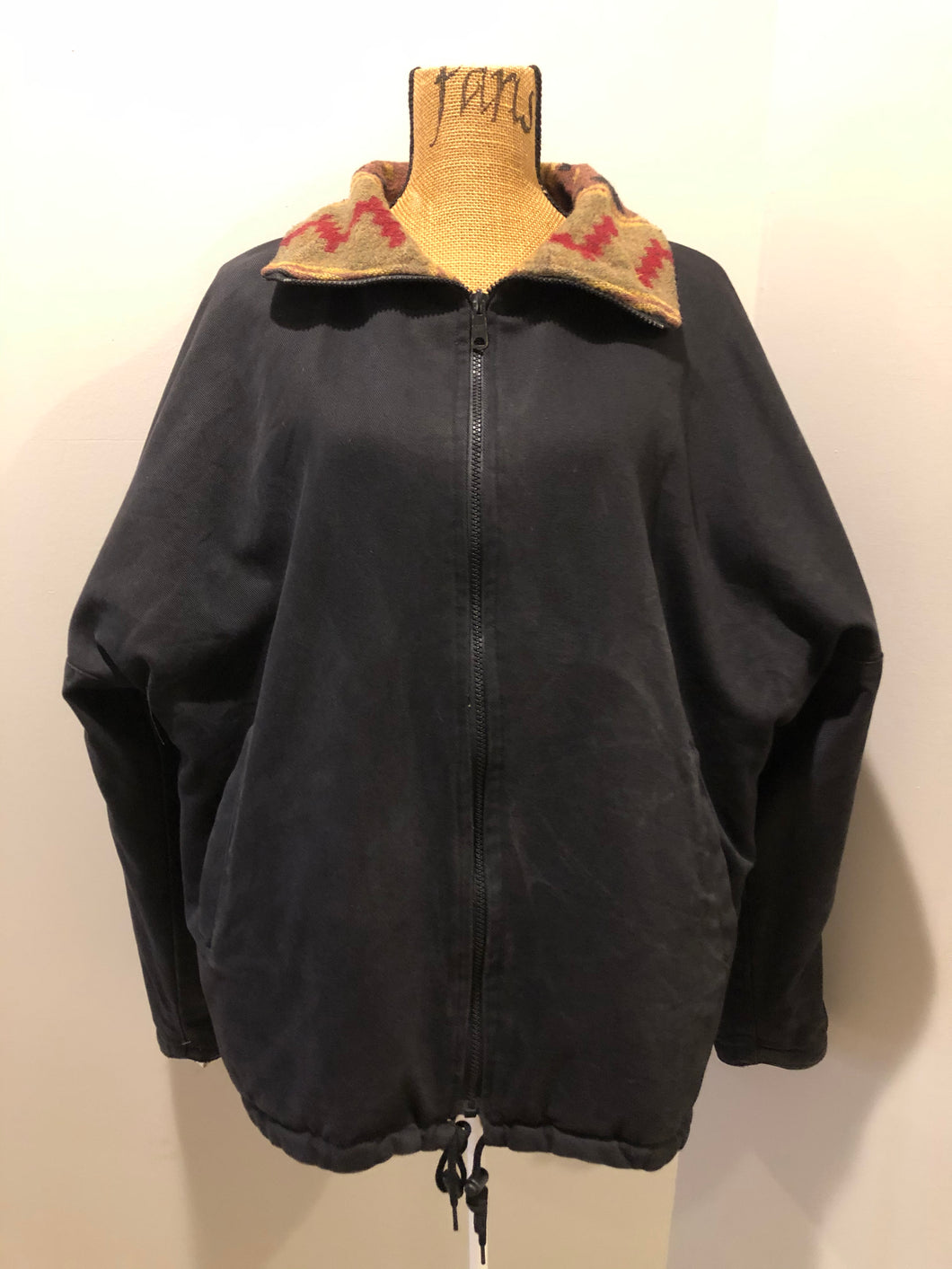 Kingspier Vintage - Reversible jacket with one side black denim and one side colourful green, red, purple ,yellow and black design, front zipper, slash pockets and a drawstring at the waist. 